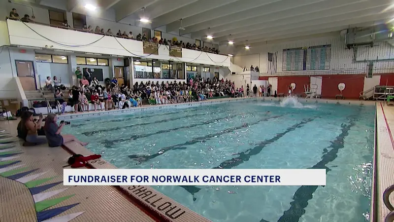 Story image: 'One of the best things we do.' Norwalk High School's annual 'Bear Flop' raises money for cancer center