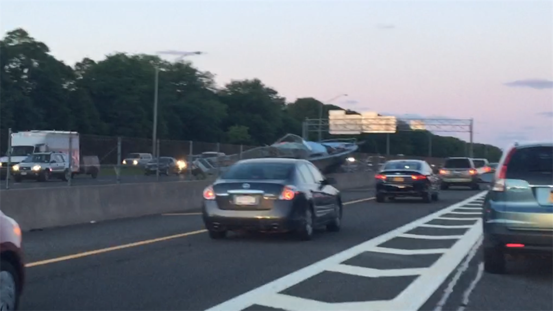 Boat falls off trailer, crashes on Long Island Expressway