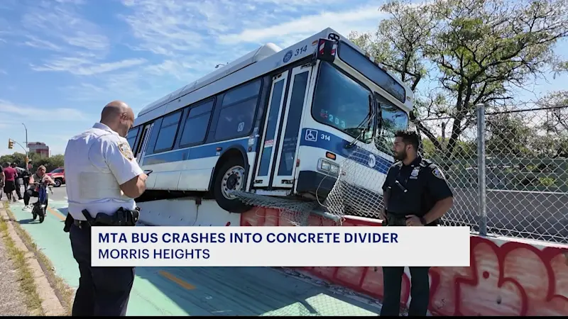 Story image: MTA bus collides with concrete divider in Morris Heights