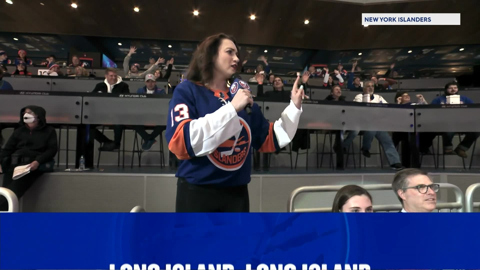 News 12 s Meredith Garofalo sings New York New York at Isles game