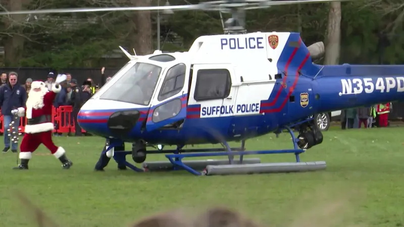 Story image: Kris Kringle arrives by chopper to kick off East Hampton’s Santa Fest