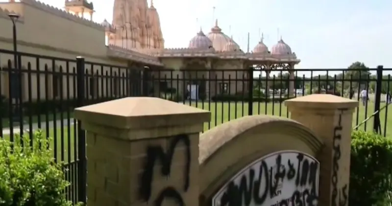 Story image: 'It was horror and disbelief.' Graffiti written on Hindu temple in Melville as police conduct hate crime investigation