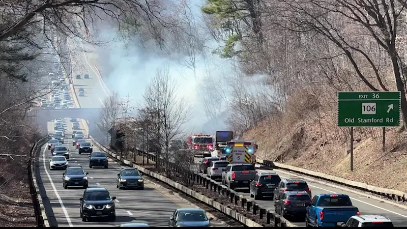 Story image: Car fire sparks acre-long brush fire on Merritt Parkway