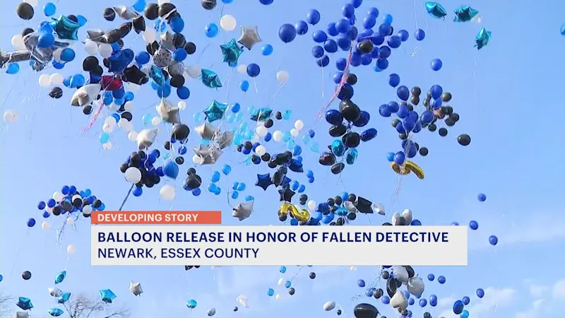 Story image: Community honors Newark police detective killed in shooting with balloon release