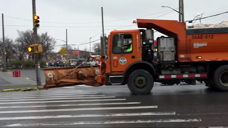 Story image: Department of Sanitation clearing roads amid snowstorm