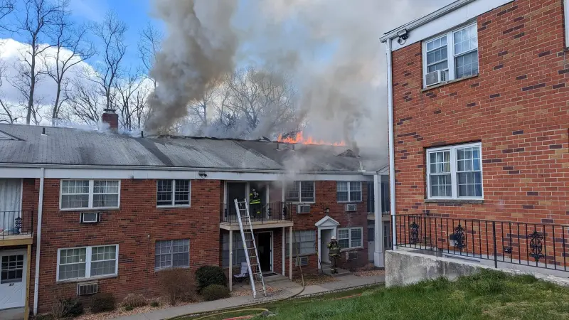 Story image: Fire tears through roof of condo building in Beacon; no injuries reported
