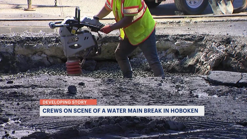 Story image: Crews repair a water main break in Hoboken; water restored to nearby apartments.