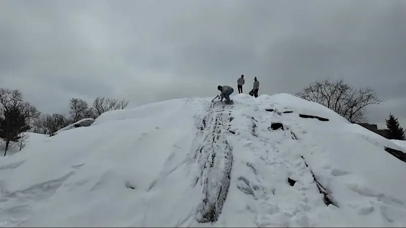 Story image: Snow cleanup continues at NYC Parks; New Yorkers use pizza boxes as sleds