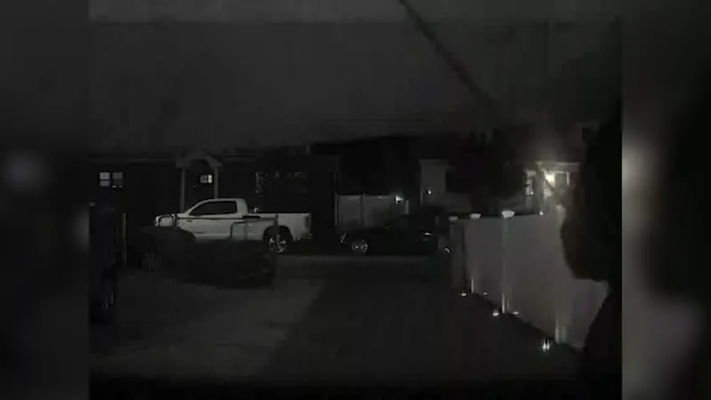 Story image: Caught on camera: Masked person smashes Tesla windshield in West Hempstead