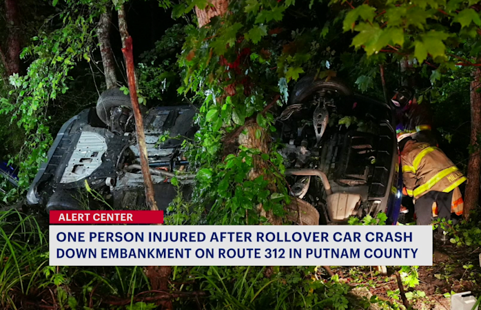 Story image: Driver rescued after rollover crash down an embankment in Brewster