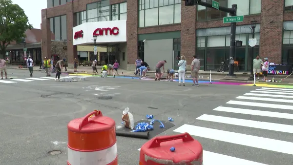 Volunteers, city leaders repaint neighborhood street to enhance pedestrian safety
