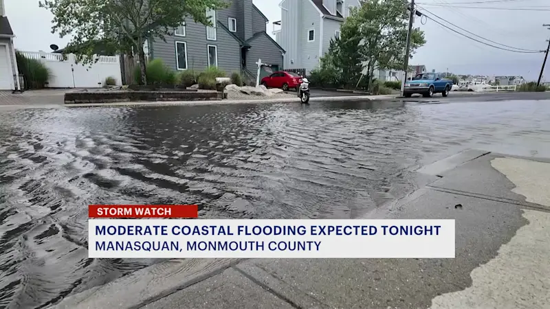 Story image: Hurricane Erin whips up surf and sand on New Jersey coast