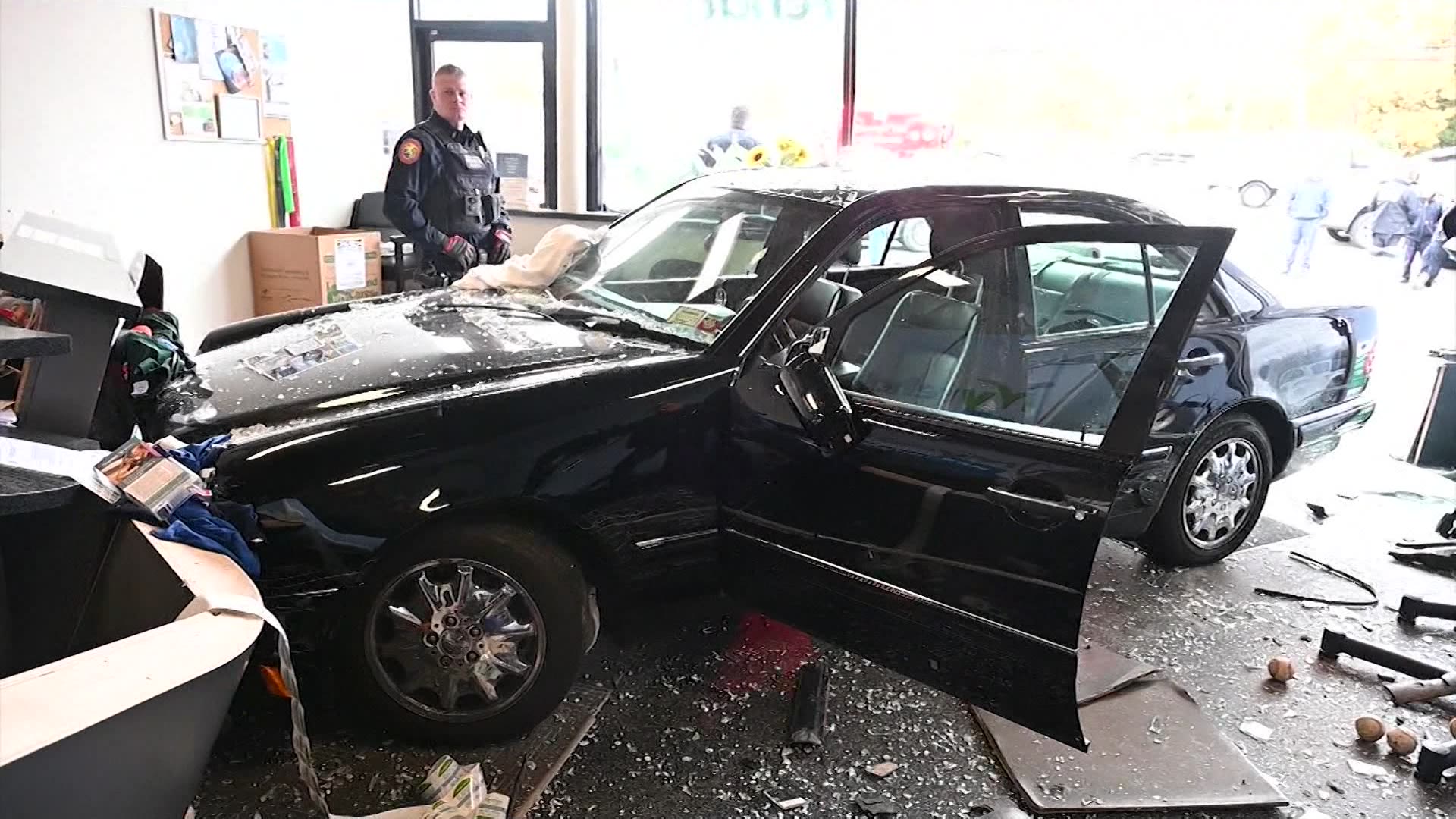 Car drives through Syosset storefront at the Muttontown Plaza