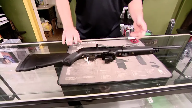 Story image: Riverhead gun shop owner raffles off semiautomatic weapon for school volleyball team; district officials won't accept funds