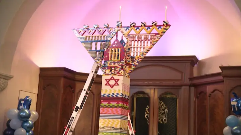 Story image: Families kick off Hanukkah by helping build 12-foot Lego menorah