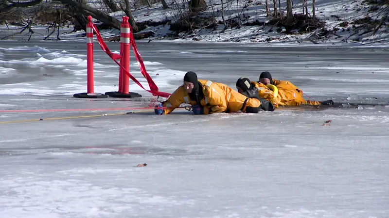 Story image: Milford firefighters conduct ice rescue training at Walker Pond