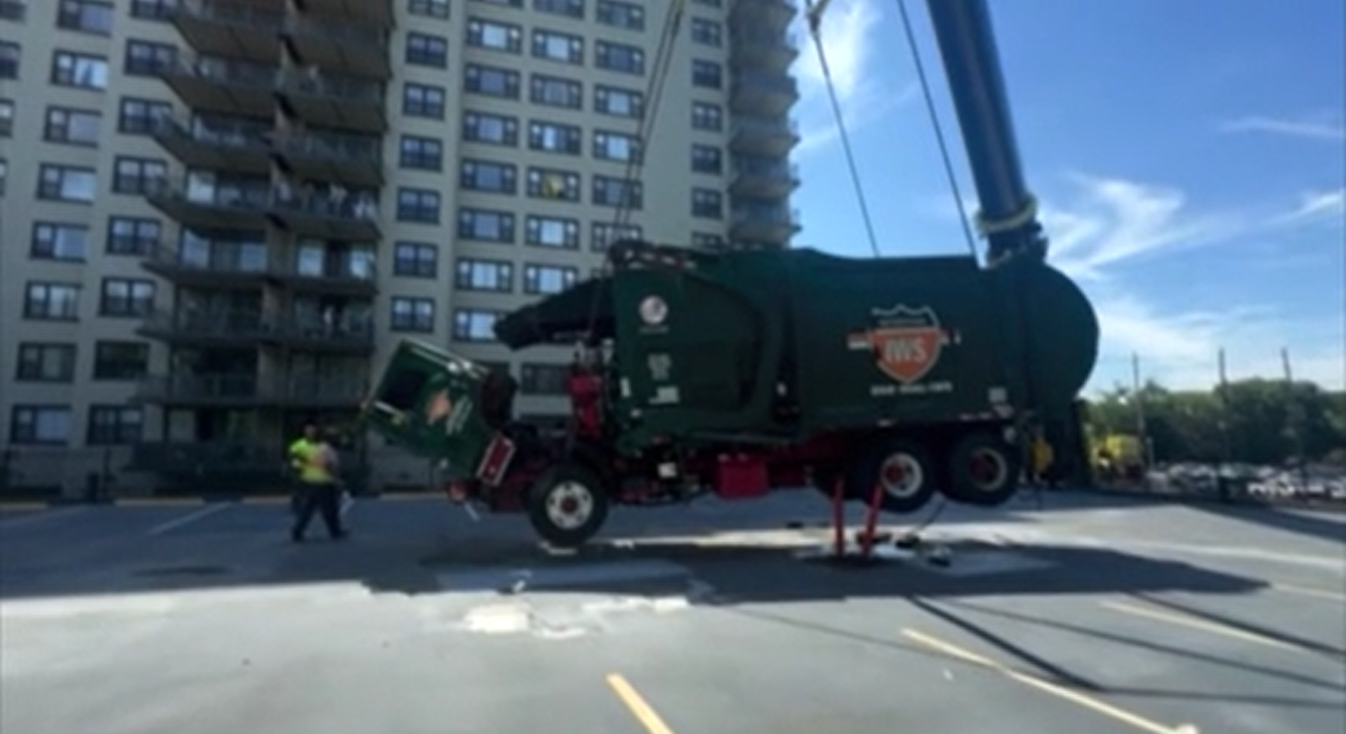 It's out!! Crews remove trash truck stuck in Clifton parking garage deck