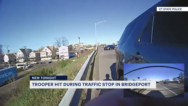 Video released by CSP shows the moment a Connecticut state trooper is struck by a car on I-95 in Bridgeport