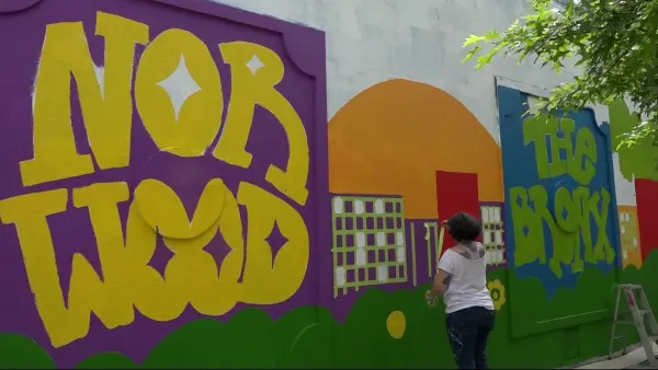 Norwood neighbors help restore vandalized mural