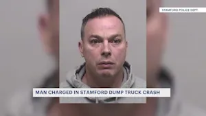 Police: Stamford man charged in dump truck crash