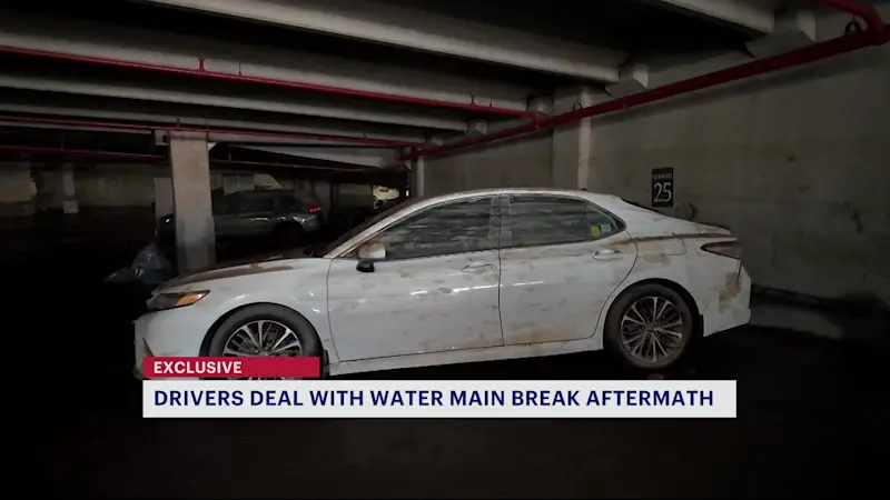 Story image: Dozens of cars stuck inside Bedford Park garage as water main break aftermath continues