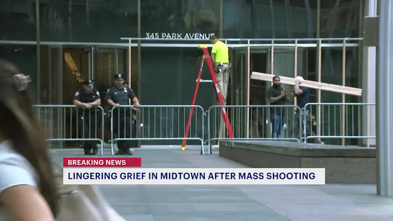 Story image: Entrance to building where midtown mass shooting took place closed off