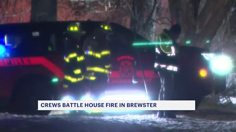 Story image: Fire crews: Family safe after house fire in Brewster