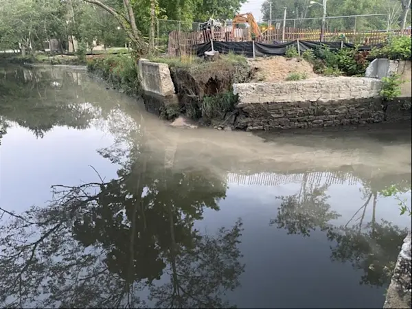 Story image: Discolored water flowing into Nissequogue River after contractor struck an underground spring in Smithtown