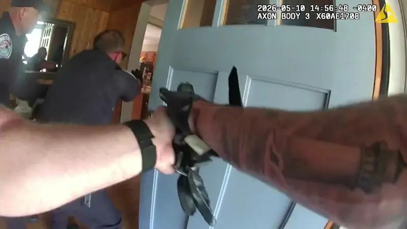 Story image: Bodycam footage shows police facing blood-covered son accused of stabbing mother over 40 times