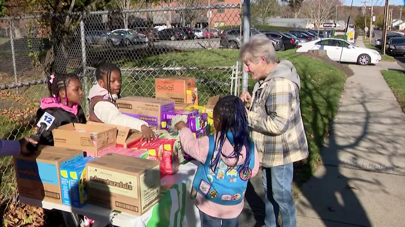 Story image: Bridgeport's first Girl Scout Troop selling cookies to help community