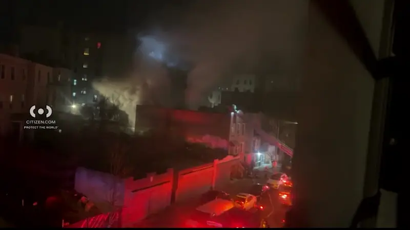 Story image: Basement fire sends thick smoke into night sky in Morris Heights