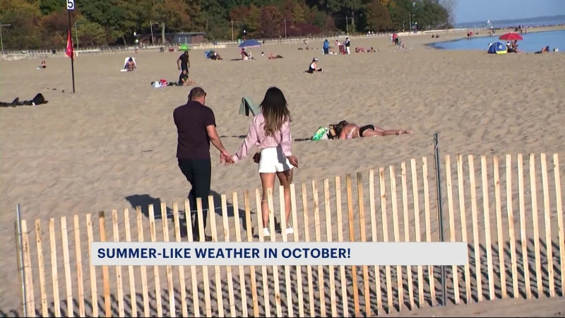 Story image: Bronx residents head to Orchard Beach to enjoy 80s in October