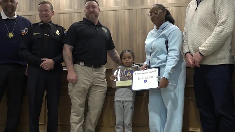 Story image: Stamford police honors 7-year-old boy for saving his mother