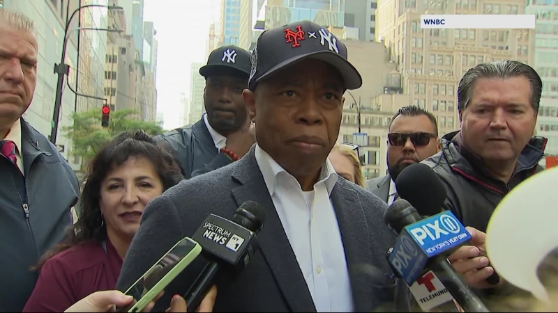 Story image: Mayor Adams faces latest controversy: Wearing hat with both Yankees and Mets logos