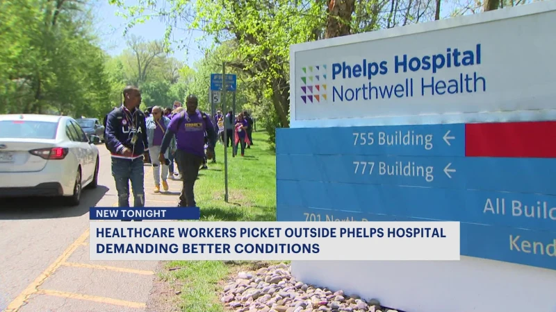 Story image: Health care workers picket outside Phelps Hospital demanding better conditions
