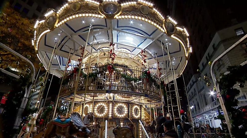 Story image: Road Trip: Ride the holiday magic at a 2-story carousel in Midtown Manhattan