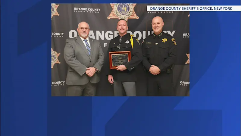 Story image: Hero on the highway: Orange County deputy honored for saving man after wreck