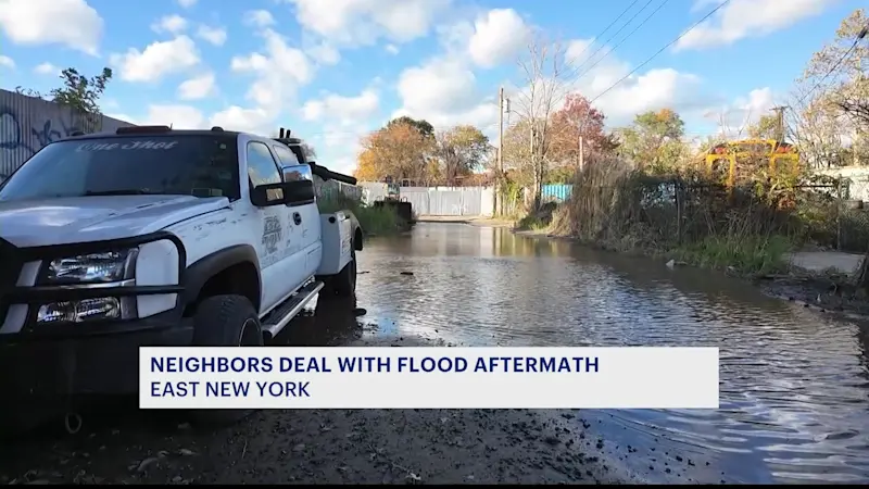 Story image: Residents in The Hole clean up flood aftermath