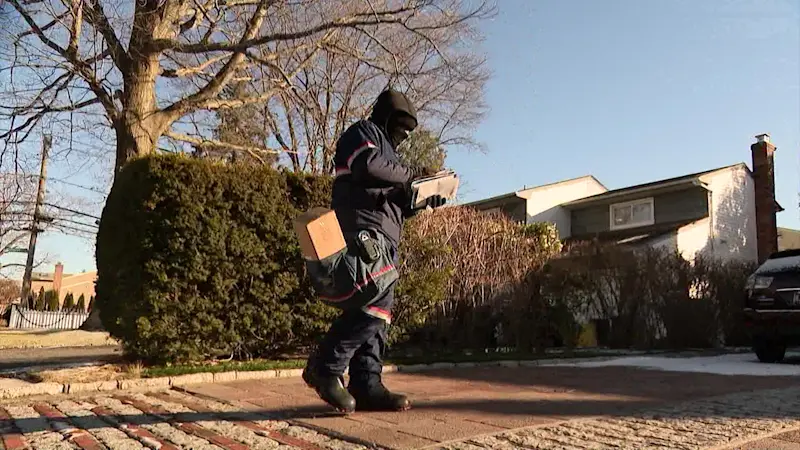 Story image: Outdoor workers brave bitter cold across Long Island