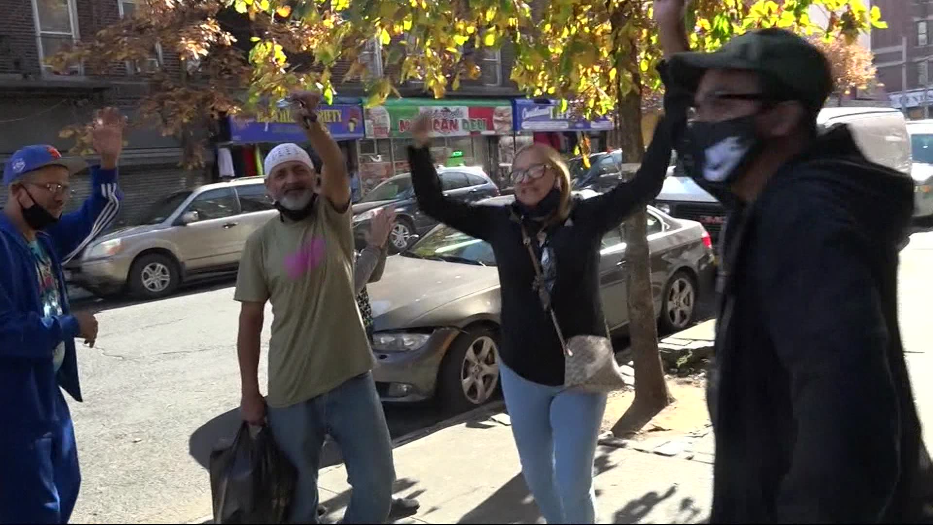 People cheer, honk horns in Mott Haven for president-elect Joe Biden