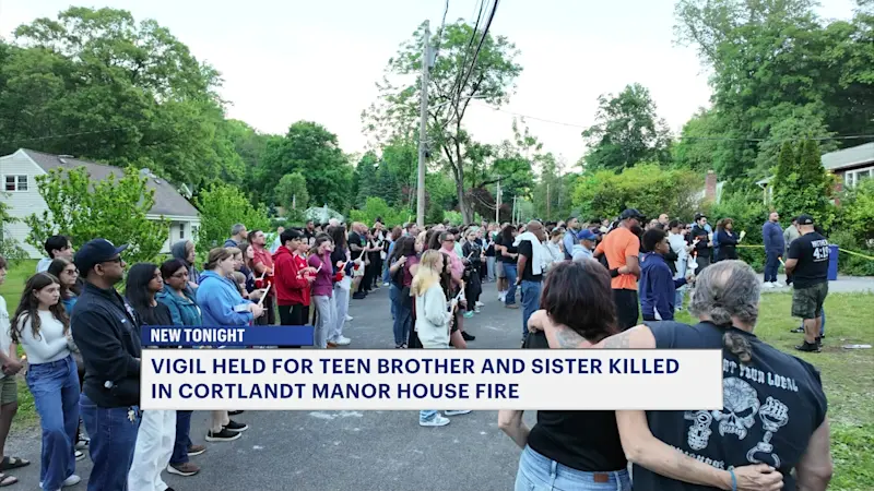 Story image: Cortlandt Manor residents hold candlelight vigil in memory of teen siblings killed in house fire