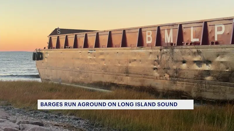 Story image: Stuck barges remain in West Haven despite salvage team efforts