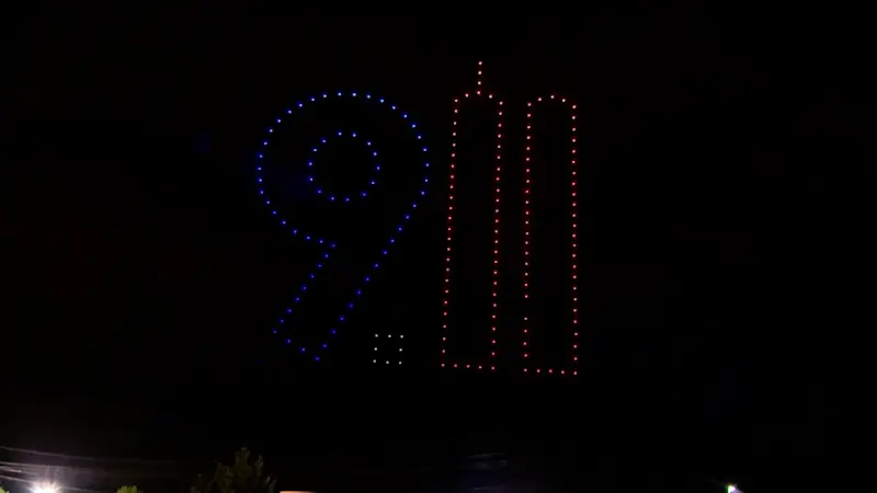 Story image: Thousands attend drone show honoring first responders who died on 9/11 and in the years after