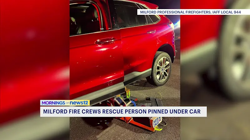 Story image: Fire crews rescue person trapped under car on I-95 in Milford