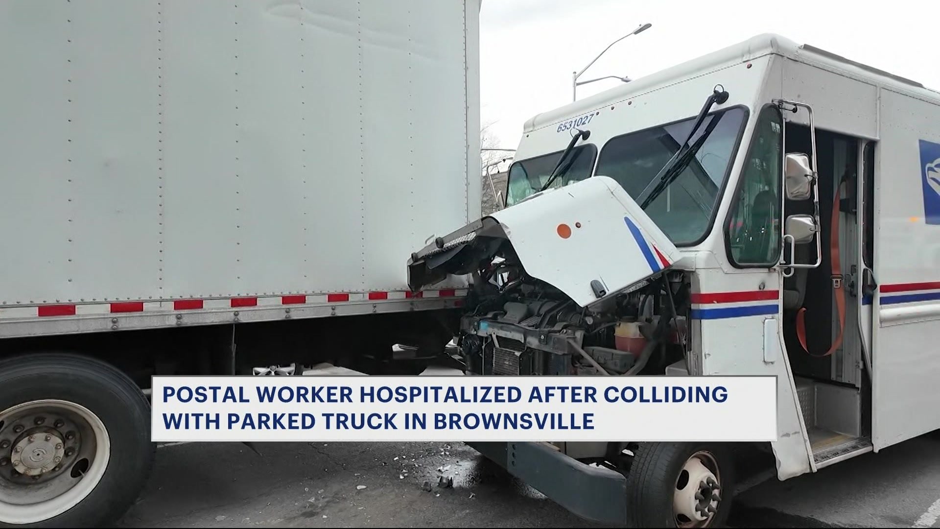 Postal worker hospitalized after collision with double-parked truck in Brownsville