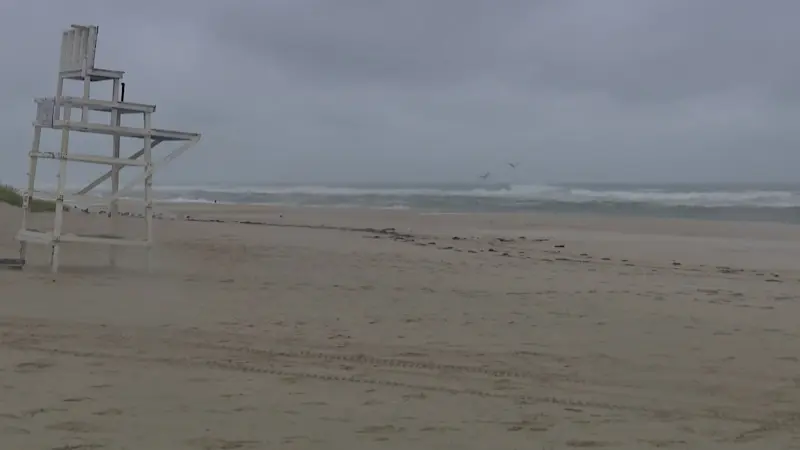 Story image: Coastal communities brace for impact as Hurricane Erin stirs up rough surf and high tides