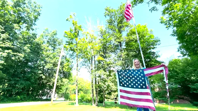 Story image: Tattered flag stuck on pole replaced just in time for July 4