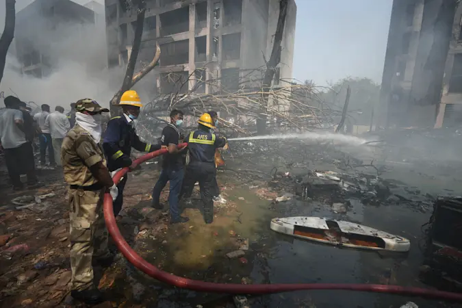 Story image: At least 240 people, including some on the ground, killed in the Air India crash, official says