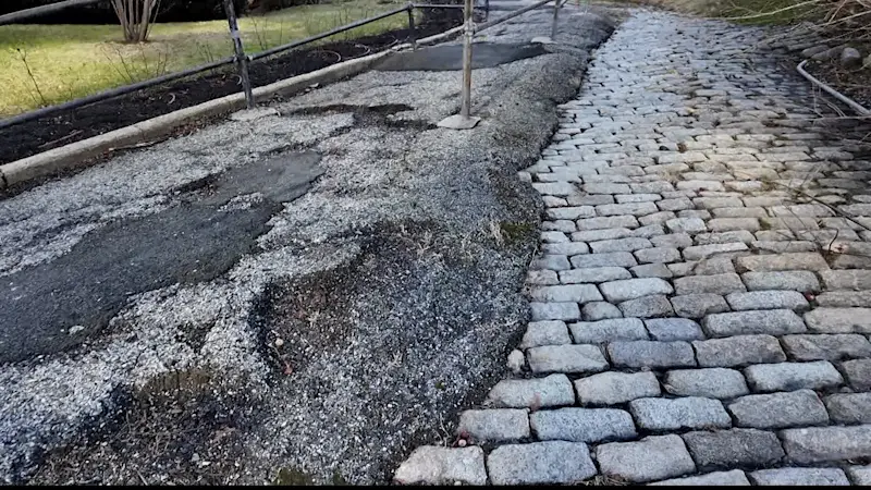 Story image: Uneven pathway continues to be long-time safety issue for Riverdale residents