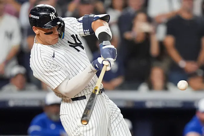 Story image: Judge rallies Yankees past Blue Jays 9-6 to save season and avert ALDS sweep